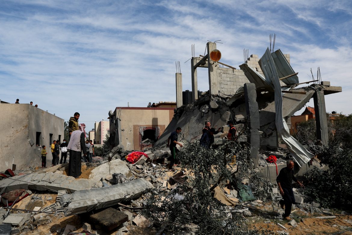 palestinians gather at the site of an israeli strike on a house, in rafah